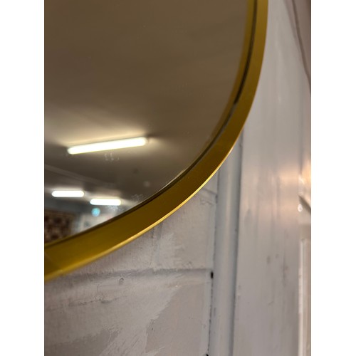 3075A - A gold circular mirror