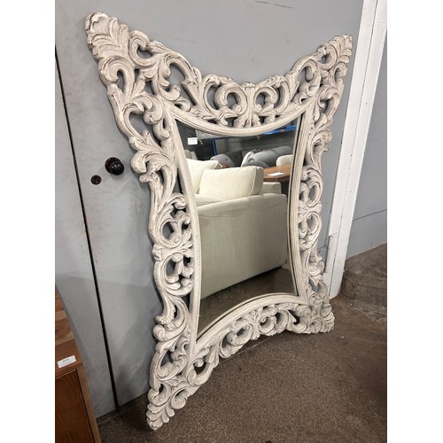 3094A - A carved ornate distressed white mirror