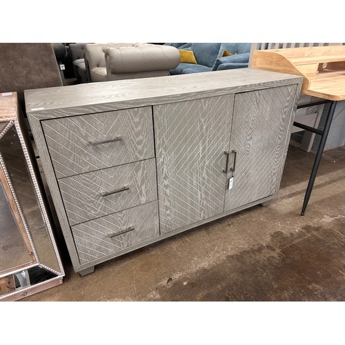 3130 - A three drawer two door grey sideboard with chevron detailing