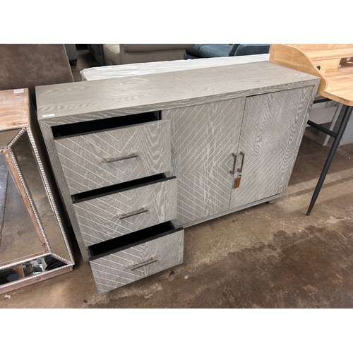 3130 - A three drawer two door grey sideboard with chevron detailing