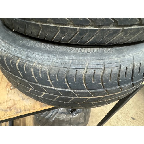 5329 - A set of four steel wheels and four tyres off a Nissan NV200 van