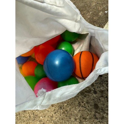 5157B - A fairground throwing ball game with a bag of plastic throwing balls