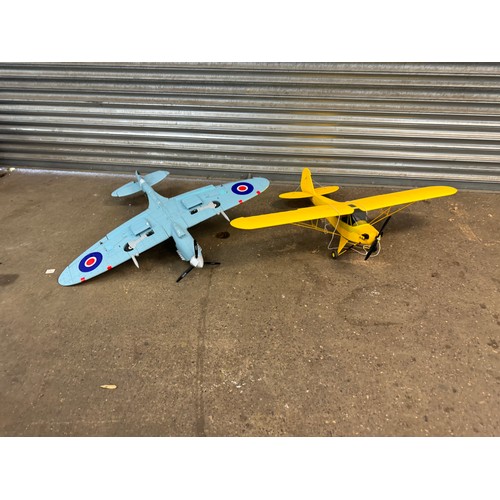 5066 - A motorized model RAF TL-B PL344 Spitfire airplane and a motorized model cub plane