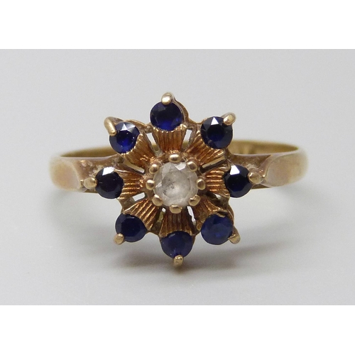 7002 - A 9ct gold, sapphire and white stone cluster ring, 1.9g, K/L