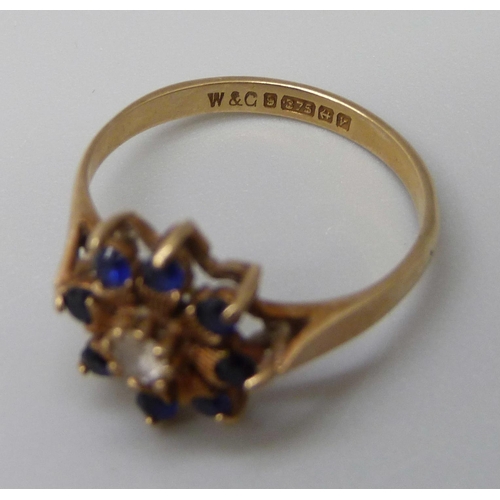 7002 - A 9ct gold, sapphire and white stone cluster ring, 1.9g, K/L