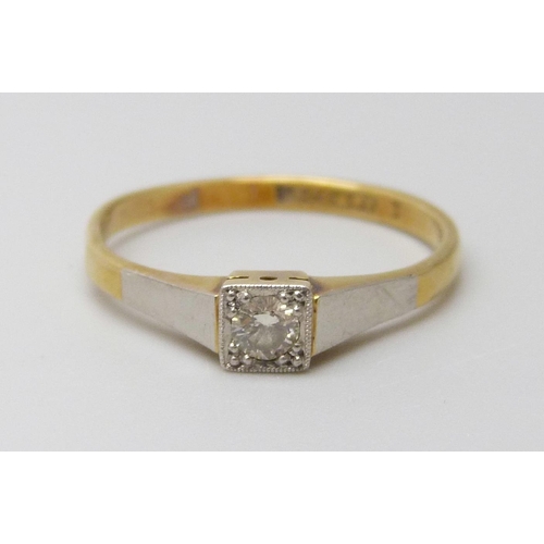 7004 - An 18ct gold and platinum diamond solitaire ring, 2.1g, M