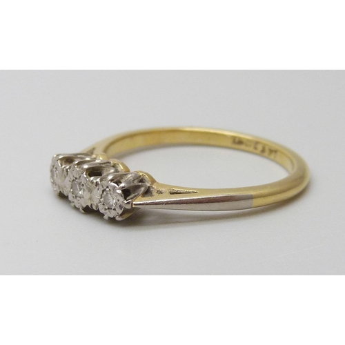 7005 - An 18ct gold and platinum three stone diamond ring, 2.5g, L