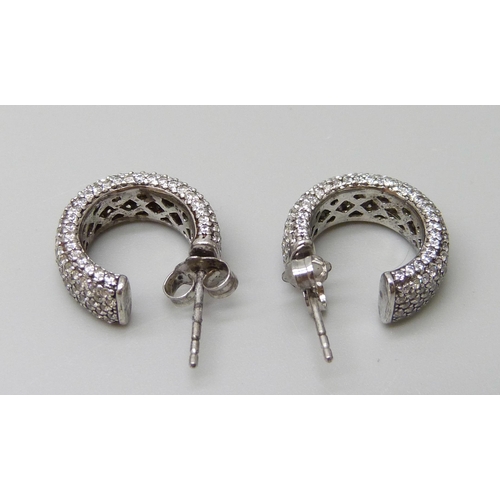 7006 - A pair of 925 sterling silver earrings set with Swarovski Zirconia