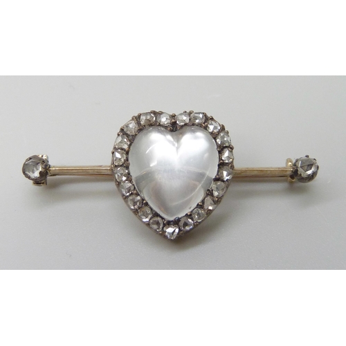 7007 - A yellow metal heart shaped moonstone and diamond brooch, 3.6cm, 3.5g