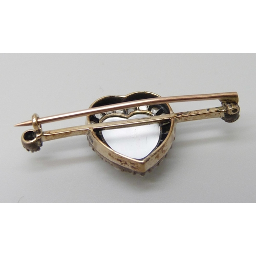 7007 - A yellow metal heart shaped moonstone and diamond brooch, 3.6cm, 3.5g