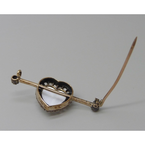 7007 - A yellow metal heart shaped moonstone and diamond brooch, 3.6cm, 3.5g