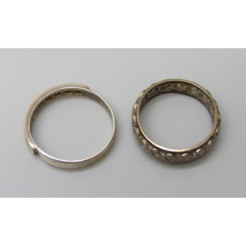 7008 - A 9ct gold and silver ring, N, and an unmarked eternity ring, J/K, 3.9g total