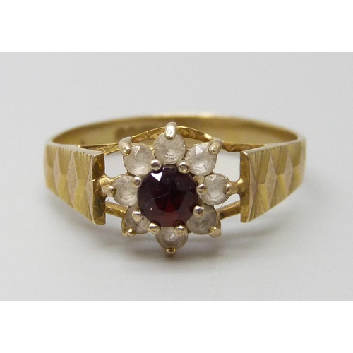 7010 - A 9ct gold, garnet and white stone cluster ring, 1.5g, K