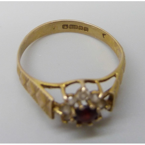 7010 - A 9ct gold, garnet and white stone cluster ring, 1.5g, K