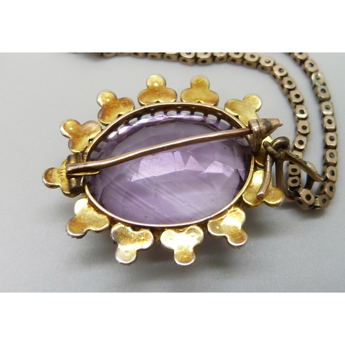 7014 - A yellow metal amethyst set pendant with a seed pearl border, on a 9ct gold chain, 15g total, pendan... 