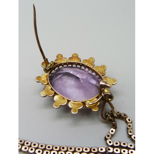 7014 - A yellow metal amethyst set pendant with a seed pearl border, on a 9ct gold chain, 15g total, pendan... 