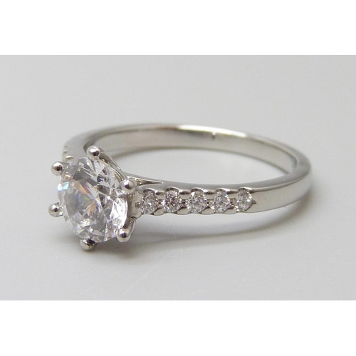 7017 - A platinum ring with a Swarovski natural white topaz and diamond shoulders, 0.15ct GH SI, 1ct centre... 