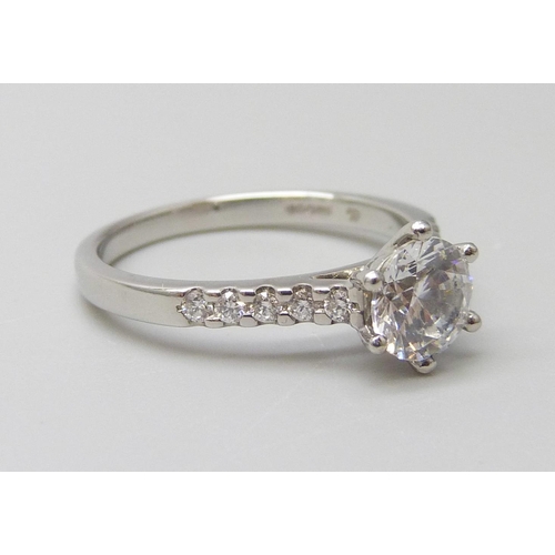 7017 - A platinum ring with a Swarovski natural white topaz and diamond shoulders, 0.15ct GH SI, 1ct centre... 