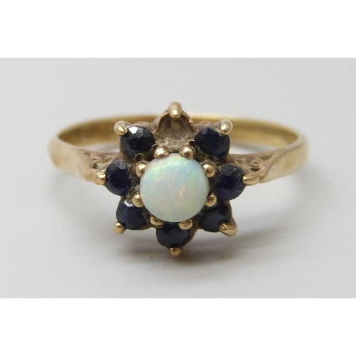 7018 - A 9ct gold, opal and sapphire ring, one stone missing, 1.8g, L