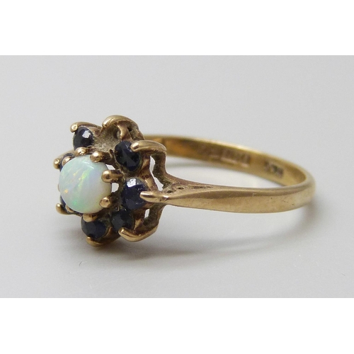 7018 - A 9ct gold, opal and sapphire ring, one stone missing, 1.8g, L