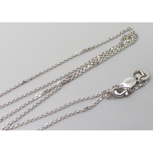 7021 - An 18ct white gold diamond and mother of pearl pendant on an 18ct white gold 18 inch chain, 0.03ct, ... 