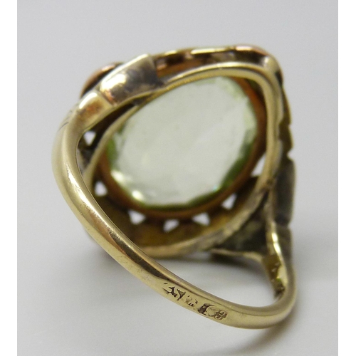 7027 - A Russian 14ct gold Art Nouveau ring set with a synthetic oval green spinel stone, 6g, M