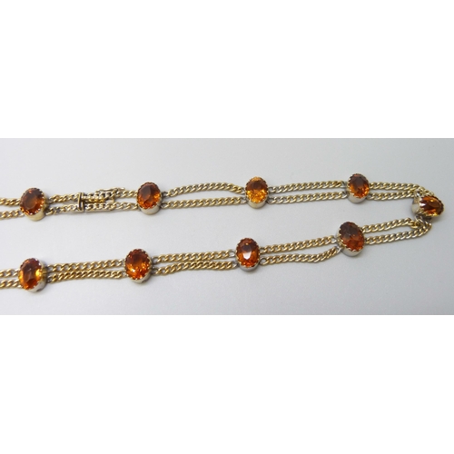 7028 - A 9ct gold citrine set double chain necklace, 20.2g, 39.5cm