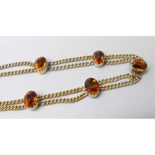 7028 - A 9ct gold citrine set double chain necklace, 20.2g, 39.5cm