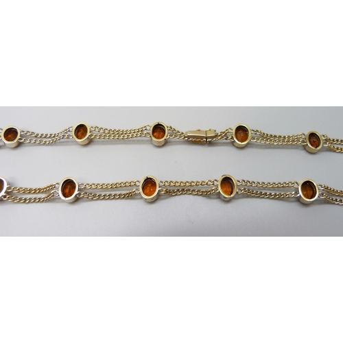 7028 - A 9ct gold citrine set double chain necklace, 20.2g, 39.5cm