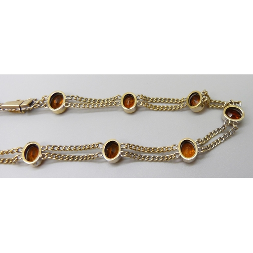 7028 - A 9ct gold citrine set double chain necklace, 20.2g, 39.5cm