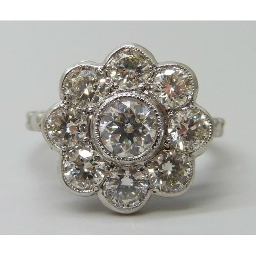 7029 - A platinum and diamond daisy cluster ring, approximately 2ct diamond weight, 6.3g, M