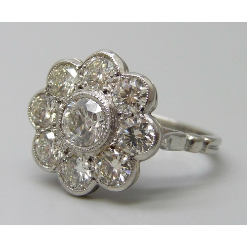 7029 - A platinum and diamond daisy cluster ring, approximately 2ct diamond weight, 6.3g, M