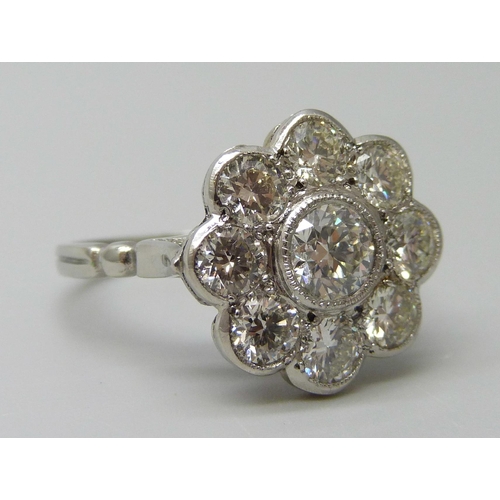 7029 - A platinum and diamond daisy cluster ring, approximately 2ct diamond weight, 6.3g, M