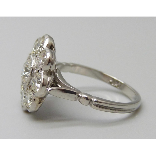 7029 - A platinum and diamond daisy cluster ring, approximately 2ct diamond weight, 6.3g, M