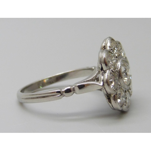 7029 - A platinum and diamond daisy cluster ring, approximately 2ct diamond weight, 6.3g, M