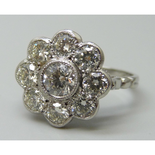 7029 - A platinum and diamond daisy cluster ring, approximately 2ct diamond weight, 6.3g, M