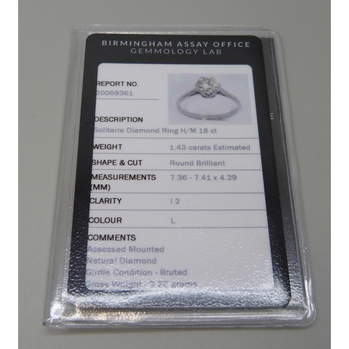 7031 - An 18ct white gold diamond solitaire ring with Birmingham gemology lab report confirming natural dia... 