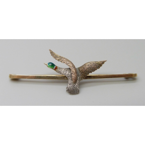 7033 - A 9ct gold and enamel pheasant design bar brooch, 2.8g, 5cm