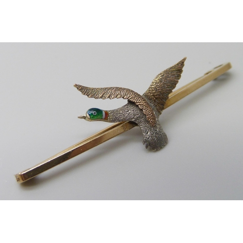 7033 - A 9ct gold and enamel pheasant design bar brooch, 2.8g, 5cm