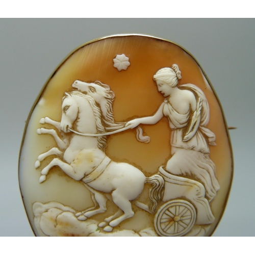 7051 - A large 9ct gold set cameo brooch depicting the Goddess Nike, 28.9g, 5.5 x 6.5cm