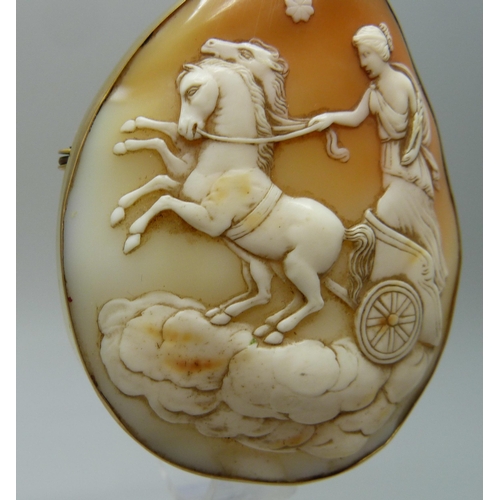 7051 - A large 9ct gold set cameo brooch depicting the Goddess Nike, 28.9g, 5.5 x 6.5cm