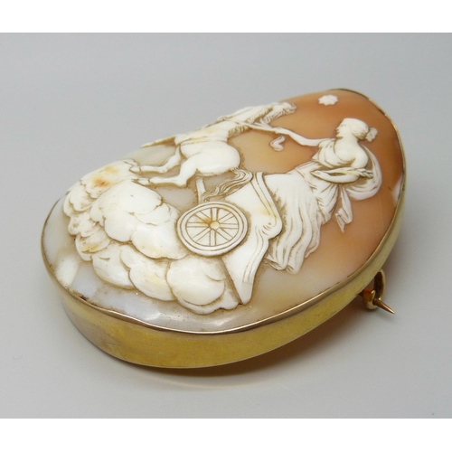 7051 - A large 9ct gold set cameo brooch depicting the Goddess Nike, 28.9g, 5.5 x 6.5cm