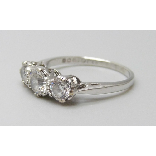 7052 - A 9ct white gold ring set with three white stones, 2.3g, L