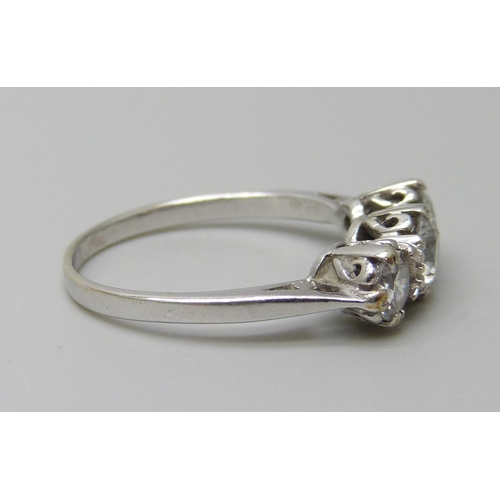 7052 - A 9ct white gold ring set with three white stones, 2.3g, L