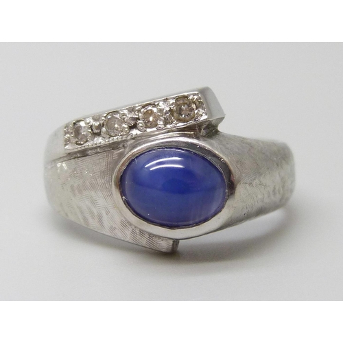 7055 - A 9ct white gold cabochon cut star sapphire and diamond set ring, 4.8g, M/N