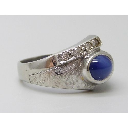 7055 - A 9ct white gold cabochon cut star sapphire and diamond set ring, 4.8g, M/N