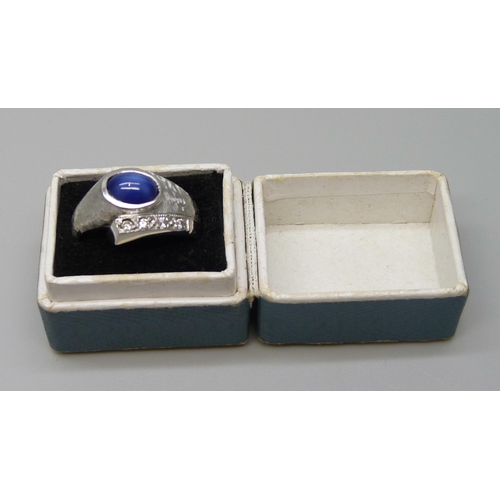 7055 - A 9ct white gold cabochon cut star sapphire and diamond set ring, 4.8g, M/N