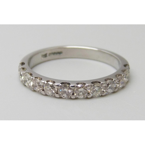 7056 - An 18ct white gold half eternity ring set with 0.75ct of G SI diamonds, 3g, M