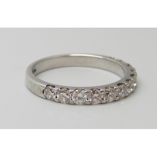 7056 - An 18ct white gold half eternity ring set with 0.75ct of G SI diamonds, 3g, M