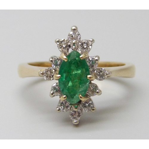 7057 - An 18ct gold, marquise cut emerald and diamond ring, very slight chip to emerald, 4.3g, L